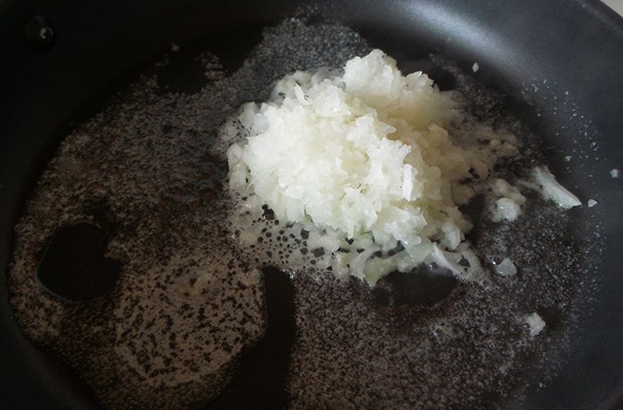 Melted butter and onions in skillet